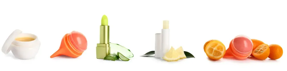 Set of different lip balms on white background